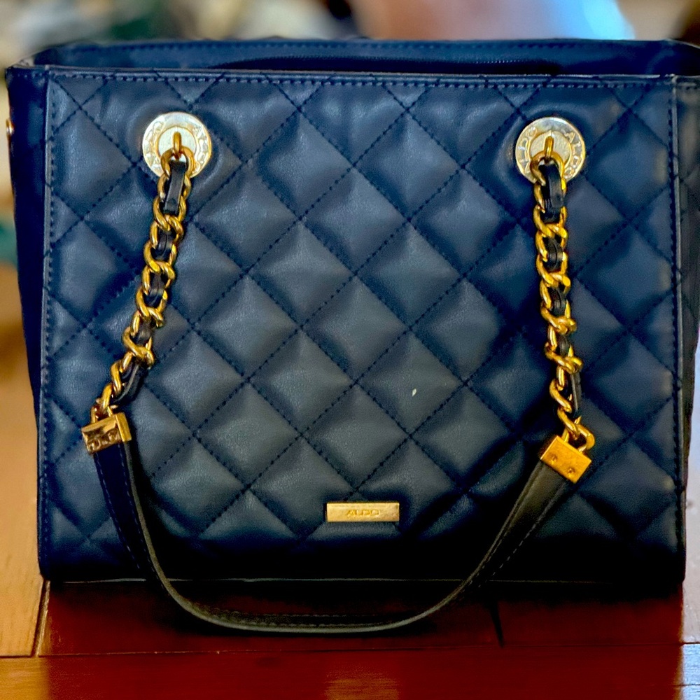 Navy quilted vegan leather bag.